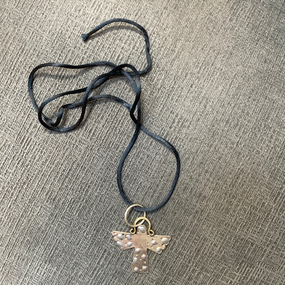 Sterling silver angel necklace with a black silk cord (adjustable tie cord).